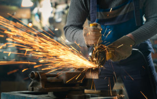 Locksmith,In,Special,Clothes,And,Goggles,Works,In,Production ,Metal